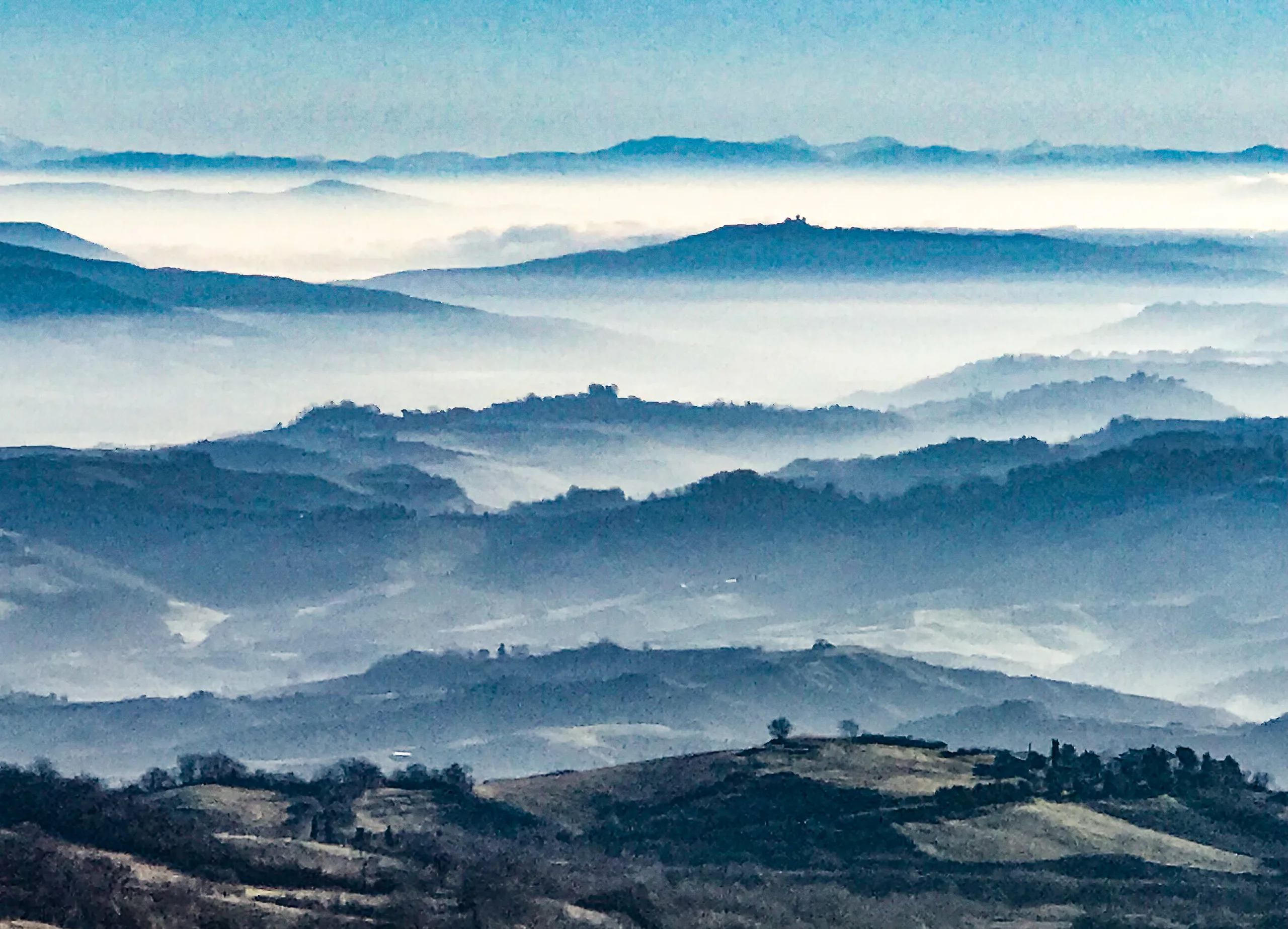 The hills above Castell'Azzara, ridges in morning mist