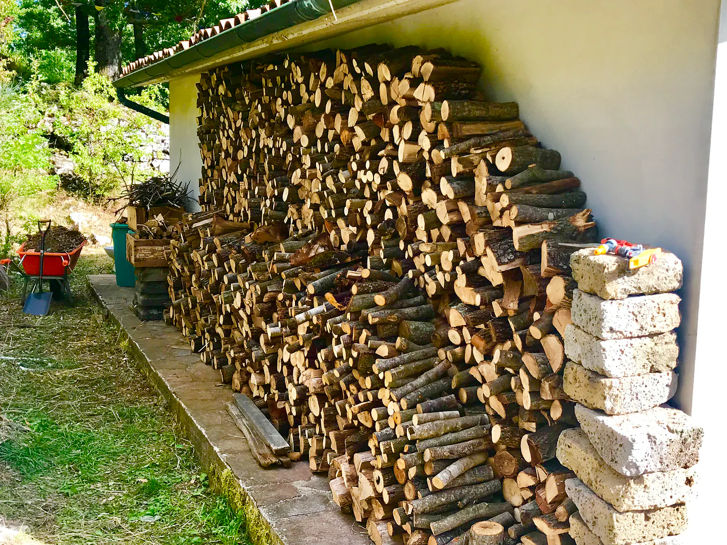 A winter's wood stacked against the house
